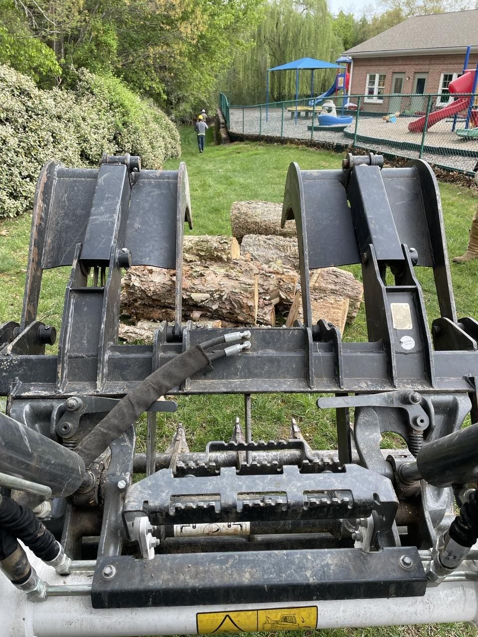 Triad Tree Removal trucks and equipment staged on a job site
